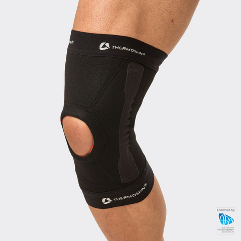 Black Thermoskin EXO Thermal Stabilising Knee Sleeve worn on a knee, with open patella and side stabiliser